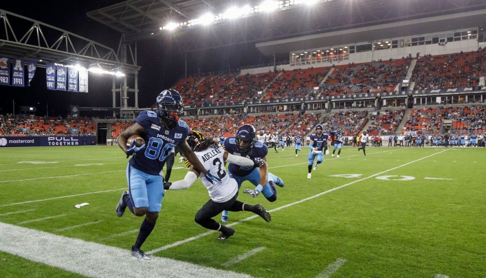 Kelly rushes for 3 TDs as defending champion Argonauts beat Tiger-Cats in  season opener