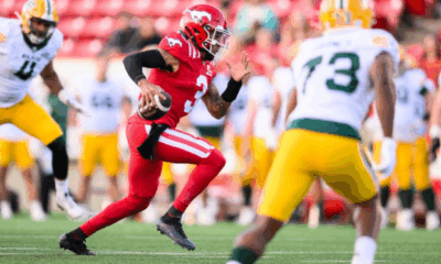 Vernon Adams Jr. running with the football.
