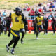 A San Antonio Brahmas player runs down the sideline away from the Vegas Vipers defense during their XFL Week 7 matchup.